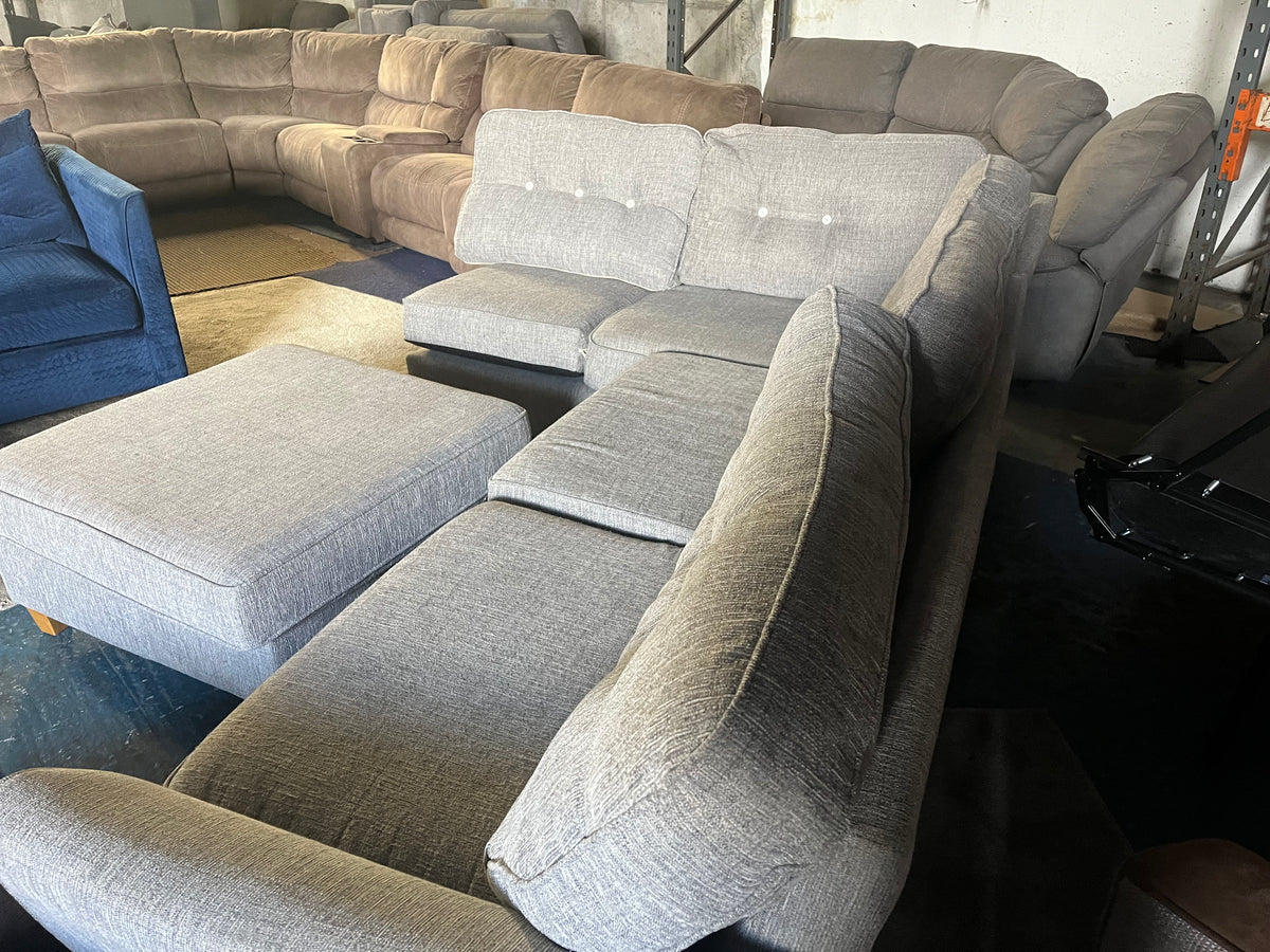 Grey corner sofa with matching footstool