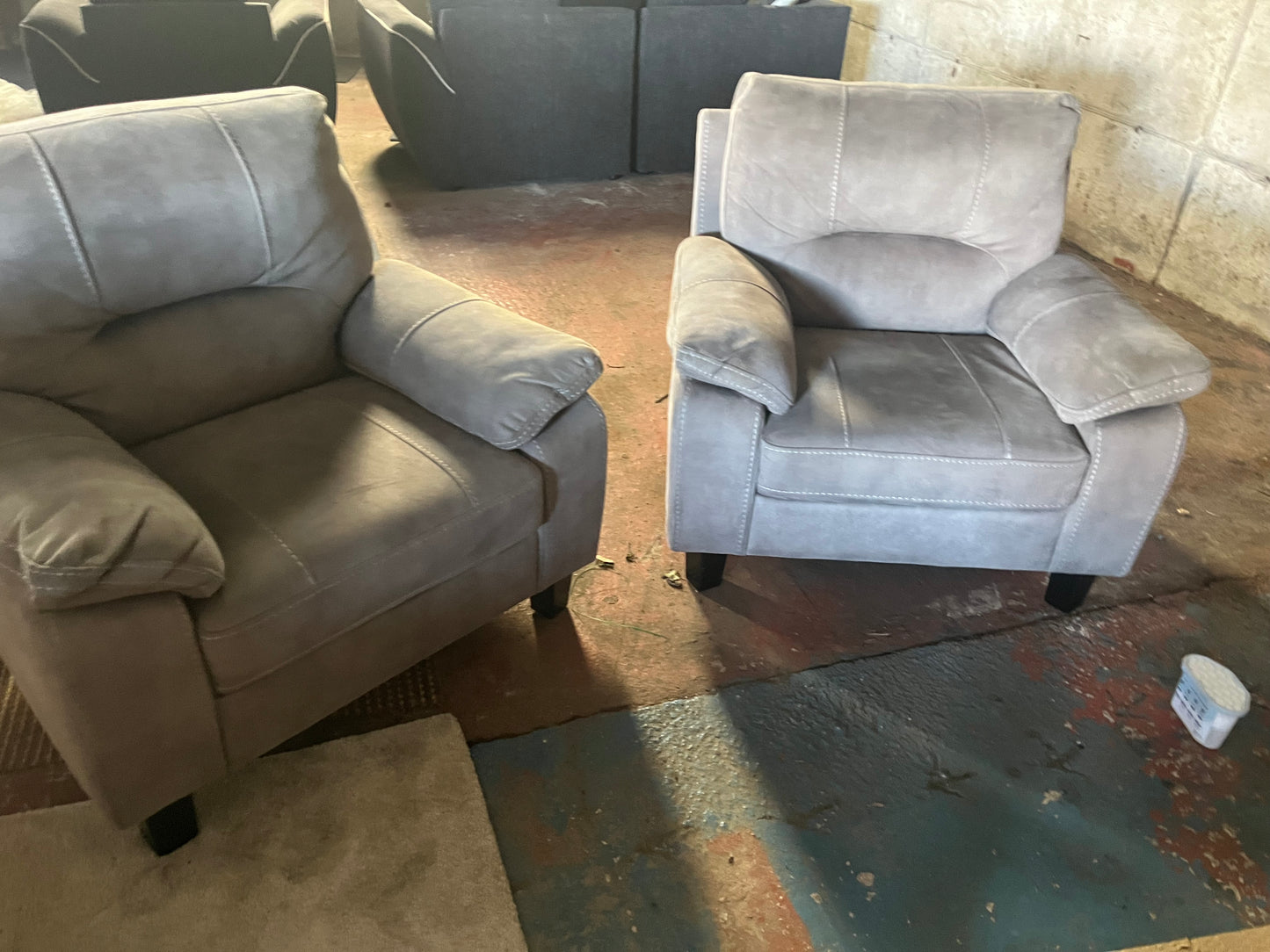 2 matching grey armchairs