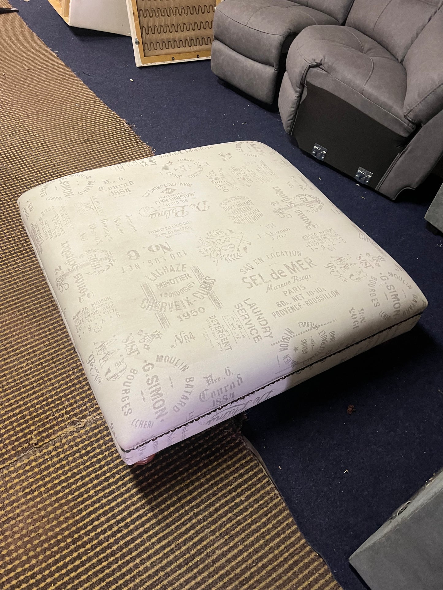 Large footstool with wooden legs