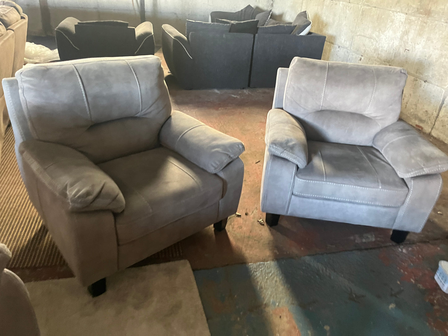 2 matching grey armchairs