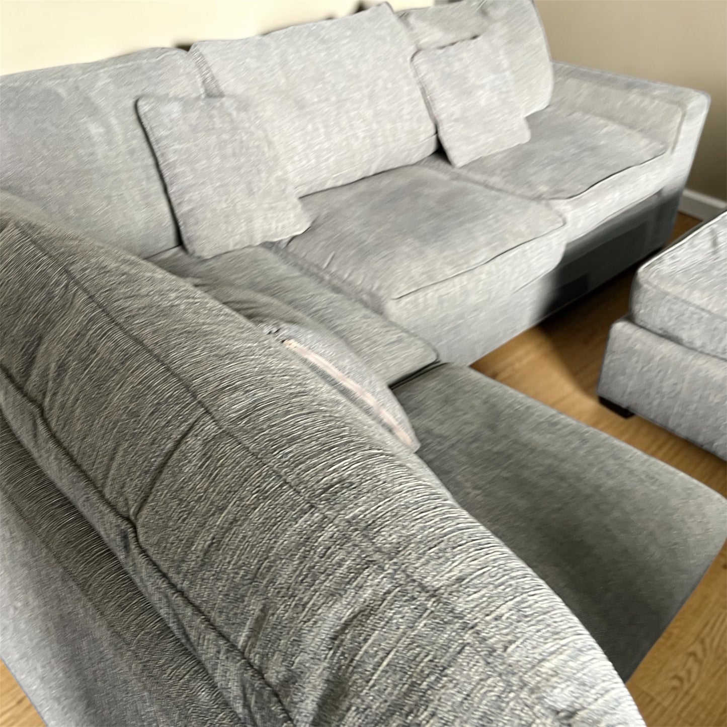 Grey corner sofa with matching footstool