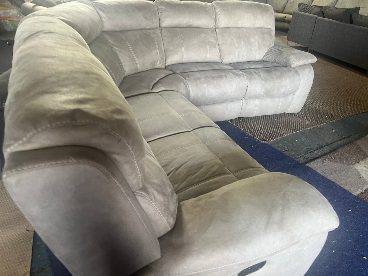 Large grey manual recliner corner sofa