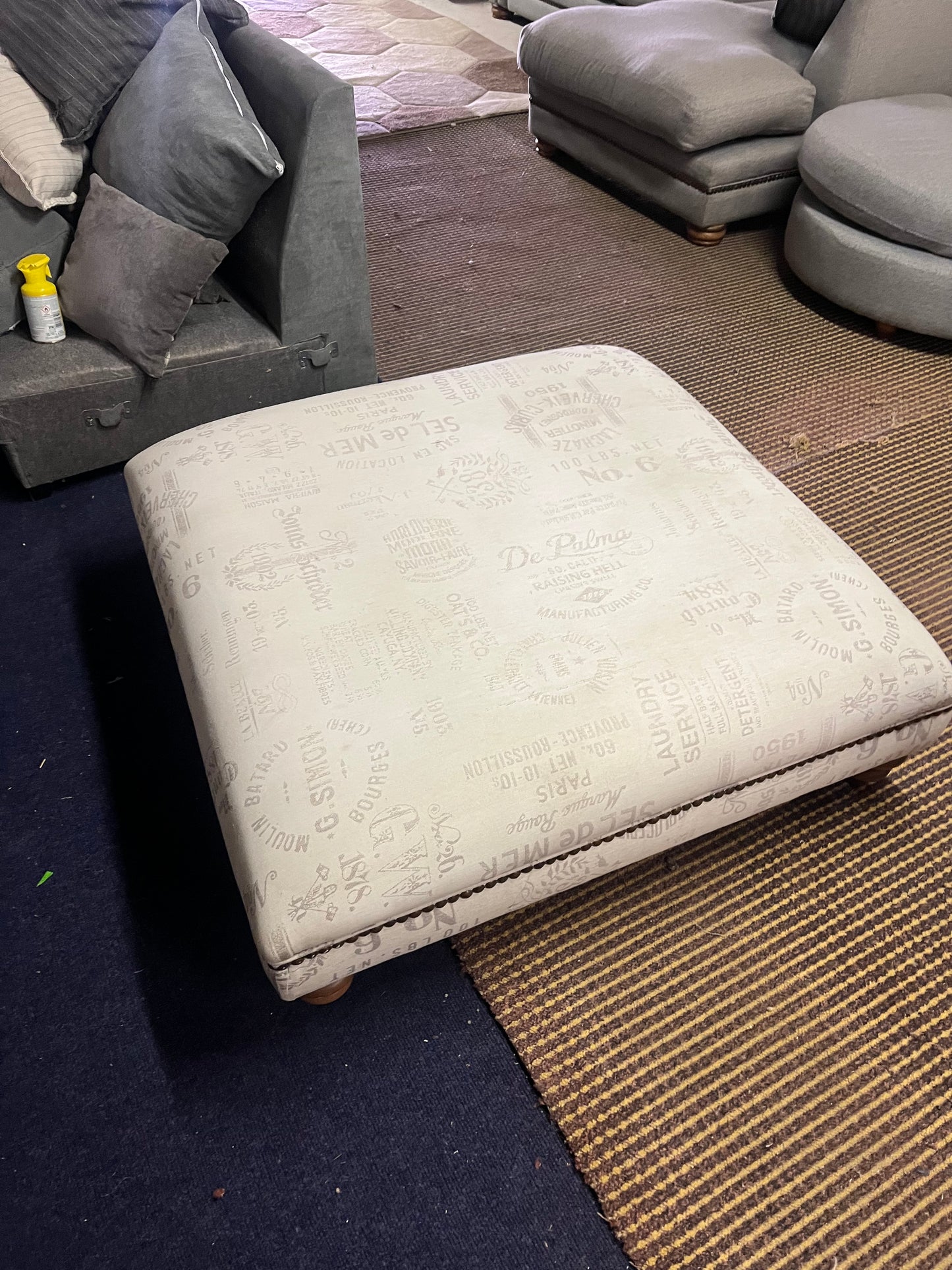 Large footstool with wooden legs