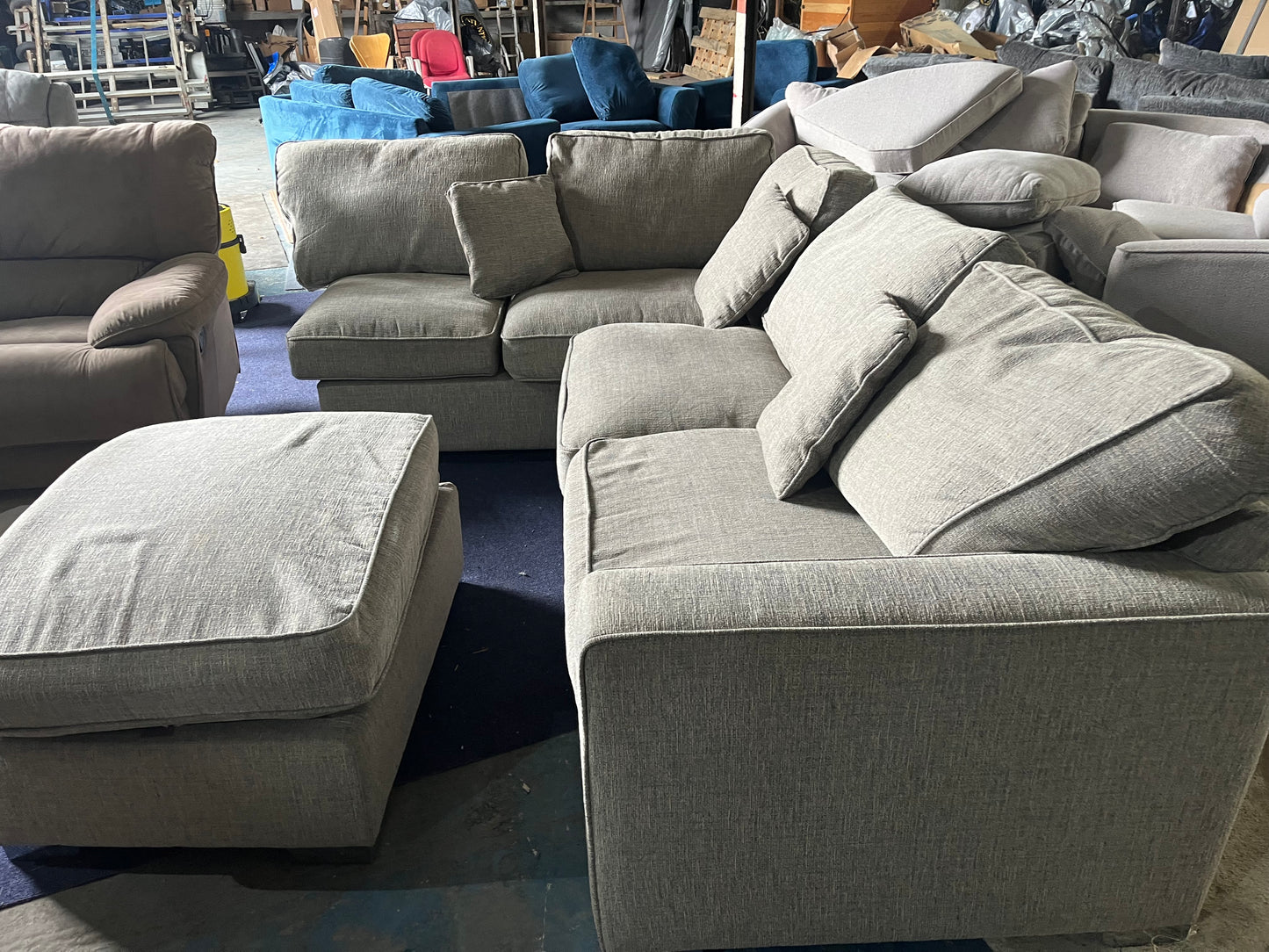 Grey corner sofa with matching footstool