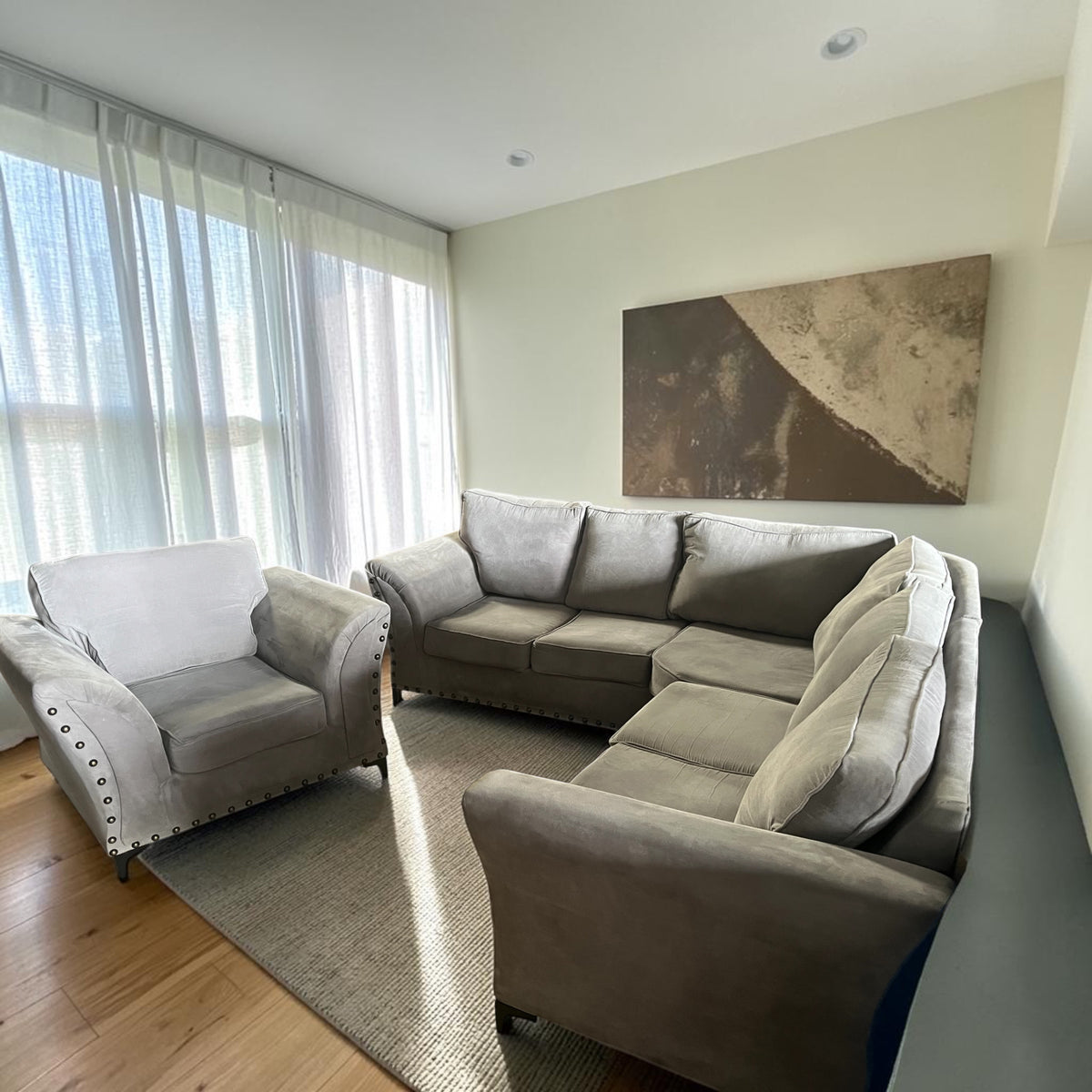 Grey corner sofa with matching armchair