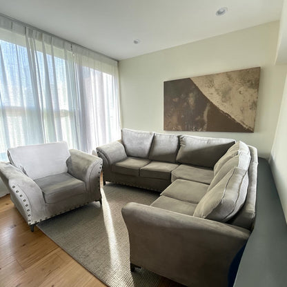 Grey corner sofa with matching armchair