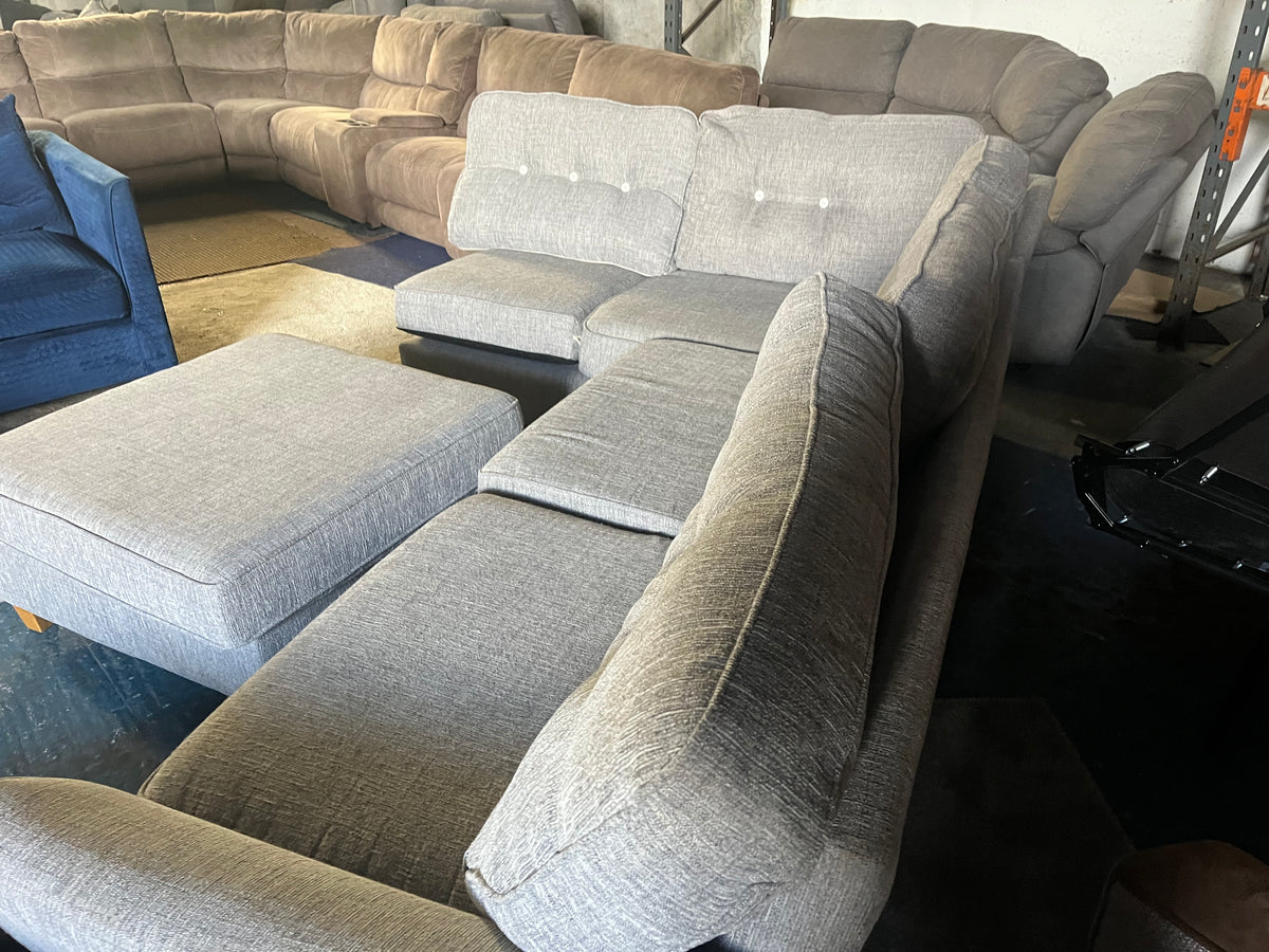Grey corner sofa with matching footstool